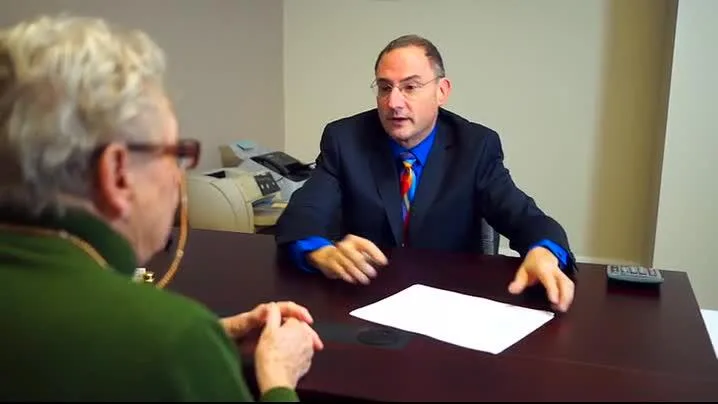Attorney Biedak meeting with a client