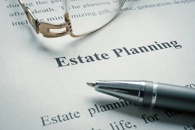 Estate planning document with glasses and pen